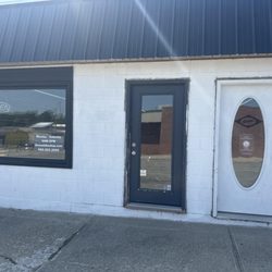 Drew’s Bike Shop - Entry doors on Bridge Street