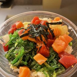 Salmon and spicy tuna, sea weed salad, edamame, cucumber, and ginger with ponzu sauce.
