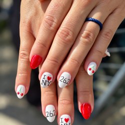 Polished Nail Salon - TCS NYC marathon nails with cherry art, glossy red accents, and custom 26.2 details at Polished Nail Salon in Oklahoma City.
