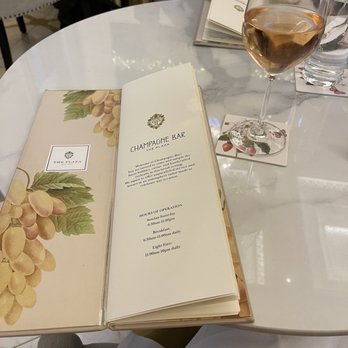 The Champagne Bar - The menu and a glass of rosé wine - Champagne Bars Near Me - New York, New York The Champagne Bar - The menu and a glass of rosé wine - Champagne Bars Near Me - New York, New York