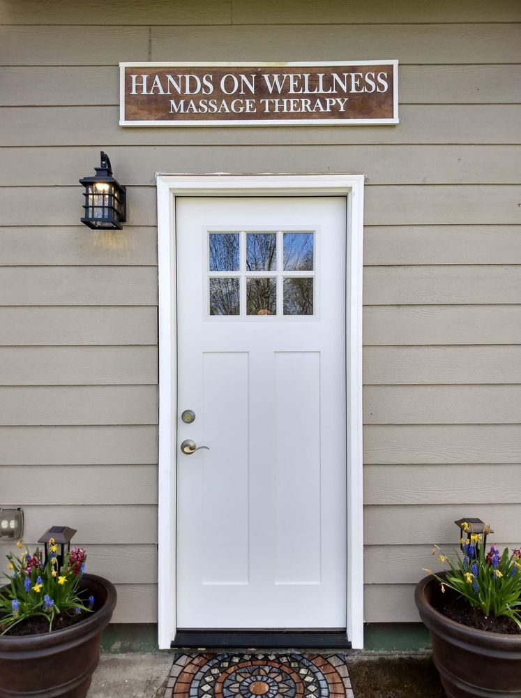 Hands on wellness massage therapy Logo