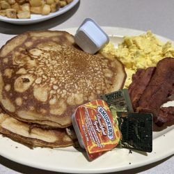 Two eggs, two pancakes, bacon