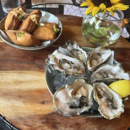 Half dozen raw oysters and crab beignets!