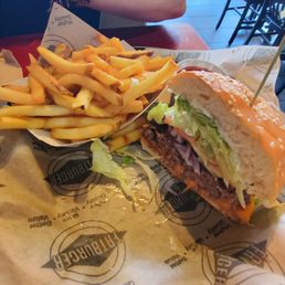 a burger and fries on a table