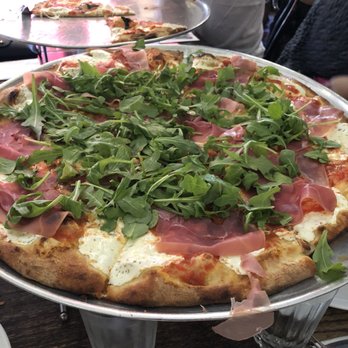 Juliana's - No. 4 Large (tomato, mozzarella, arugula, and prosciutto) - Pizza Near Me - Brooklyn, New York Juliana's - No. 4 Large (tomato, mozzarella, arugula, and prosciutto) - Pizza Near Me - Brooklyn, New York