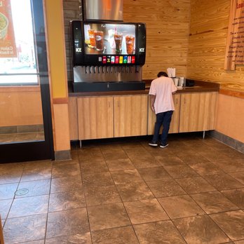 Popeyes Louisiana Kitchen - a man standing in front of a vending machine - Fast Food Near Me - St Cloud, Minnesota Popeyes Louisiana Kitchen - a man standing in front of a vending machine - Fast Food Near Me - St Cloud, Minnesota