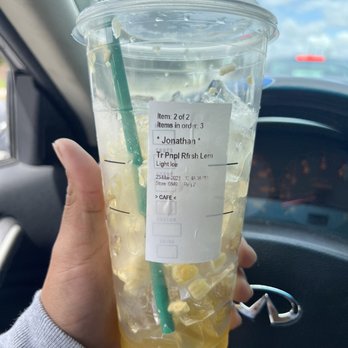 Starbucks - a hand holding a cup of iced lemonade - Coffee & Tea Near Me - Torrance, California