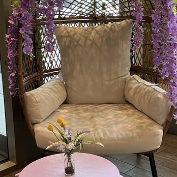 Purple Rainbow Cafe - a wicker chair and table - Coffee & Tea Near Me - Brooklyn, New York