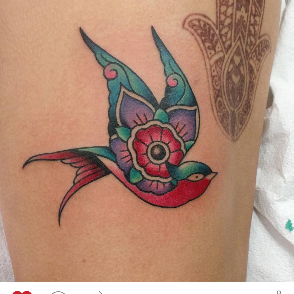 Swallow tattoo done by Marshall (fatheartattoos) Swallow tattoo done by Marshall (fatheartattoos)