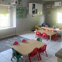 Bright and colorful preschool classroom at Childcare Network with age-appropriate learning materials