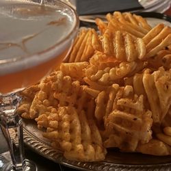 Amaretto sour and waffle fries