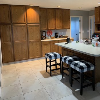 Four Corner Solutions - a kitchen with a center island - Painters Near Me