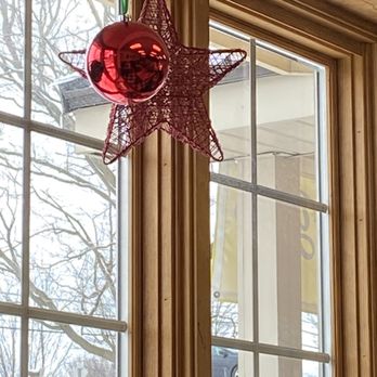 Sweet Times - a red star decoration hanging from a window - Bakeries Near Me - Victor, New York Sweet Times - a red star decoration hanging from a window - Bakeries Near Me - Victor, New York