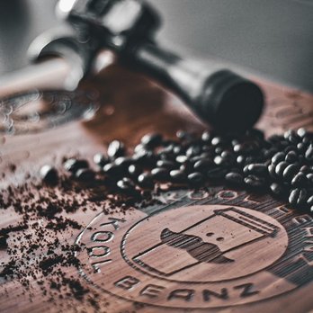 Kool Beanz - a wooden cutting board with coffee beans on it - Cafes Near Me - Rainbow City, Alabama Kool Beanz - a wooden cutting board with coffee beans on it - Cafes Near Me - Rainbow City, Alabama