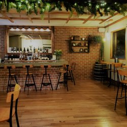 Vknow Restaurant and Wine Bar - Rustic bar area with huge wine selection