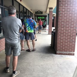 a line of people waiting outside a line of people waiting outside