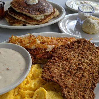 Russell's - Chicken fried steak with scrambled eggs. Short stack of pancakes in background. - American Near Me - Pasadena, California Russell's - Chicken fried steak with scrambled eggs. Short stack of pancakes in background. - American Near Me - Pasadena, California