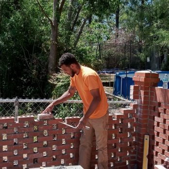 True Masonry - Thomas miller,owner of True masonry,laying a brick lattice wall. - Masonry/Concrete Near Me