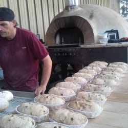 Sandwich Isle Bread Company - Loaves being prepared to be baked. This guy was super nice and conversed with us as he worked and boy, was he busy.