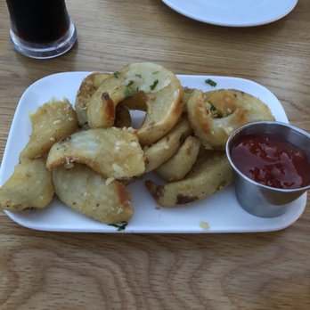 Industry Kitchen - Wood Oven Potato Curls with Garlic and Rosemary - American Near Me - New York, New York Industry Kitchen - Wood Oven Potato Curls with Garlic and Rosemary - American Near Me - New York, New York