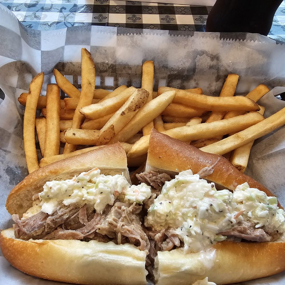 Pork sandwich with fries. Pork sandwich with fries.