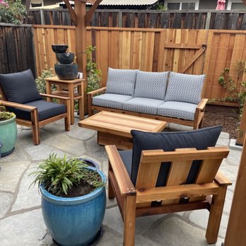 Earthcare Landscaping - a patio with wooden furniture - Landscaping Near Me - San Jose, California Earthcare Landscaping - a patio with wooden furniture - Landscaping Near Me - San Jose, California