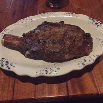 The Ranch - We shared this bone in ribeye.  We were so glad we did not get two since there was way too much fat for such an expensive piece of meat. - Steakhouses Near Me - Irving, Texas