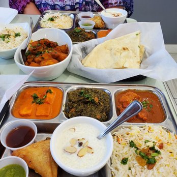 IndianBistro14 - Weekend lunch special. 3 curries, rice, samosa, and dessert. Also in picture is Cumin Potatoes and Naan. - Indian Near Me - Arlington, Texas IndianBistro14 - Weekend lunch special. 3 curries, rice, samosa, and dessert. Also in picture is Cumin Potatoes and Naan. - Indian Near Me - Arlington, Texas