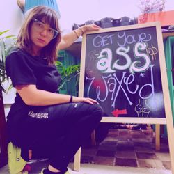 Pynk Nymph - Hannah posing next to her beautiful chalkboard sign art work!