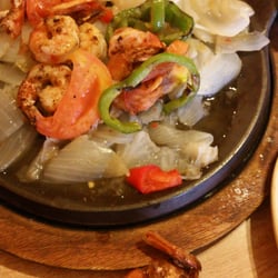 Los Amigos - Fajitas, the onions were not grilled, just watery and slimey, you can see the water in the none sizzling skillet