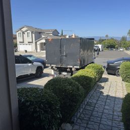 Dropping off the dumpster in the driveway Dropping off the dumpster in the driveway