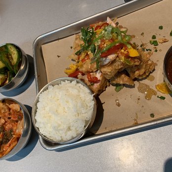 CHIKO - Orange-ish chicken and kimchi and sliced cucumbers on the side. - Asian Fusion Near Me - Encinitas, California