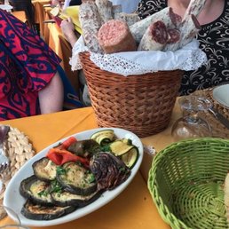 Grilled veggies (foreground) and giant bucket of sausage that came with one tomato bruschetta (background) at Gli Angeletti. Grilled veggies (foreground) and giant bucket of sausage that came with one tomato bruschetta (background) at Gli Angeletti.