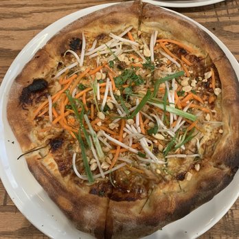 California Pizza Kitchen - two different pizzas on plates - Pizza Near Me - Northwest, Alberta
