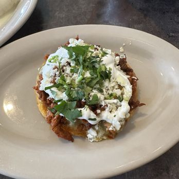 Mi Pueblito Mexican Restaurant - The fabled Sopes (it's meat--in this case, pork--beans, salsa verde, sour cream, feta, and cilantro). - Mexican Near Me - Searcy, Arkansas Mi Pueblito Mexican Restaurant - The fabled Sopes (it's meat--in this case, pork--beans, salsa verde, sour cream, feta, and cilantro). - Mexican Near Me - Searcy, Arkansas