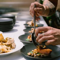 Guest chefs prepare culinary tastes for private meals and member experiences.