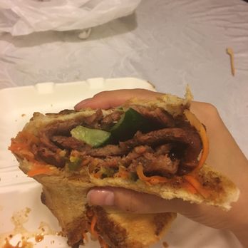 Saiguette - Looks messy but omg soo good. Roast pork shoulder - addiction. - Vietnamese Near Me - Manhattan, New York
