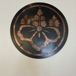 Wall hanging. Could be their logo?