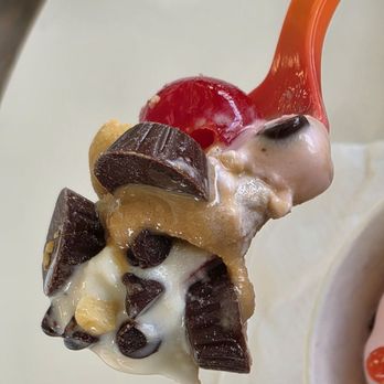 SweetFrog - Close-up of a spoonful holding my frozen yogurts together with some of the toppings I selected. - Ice Cream & Frozen Yogurt Near Me - Roanoke, Virginia