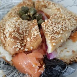 Sesame bagel with cream cheese and lox