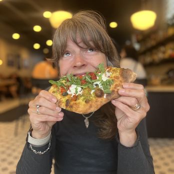 Lyle's Pizzeria - Buratta pizza and my travel partner after she lost at cribbage. - Pizza Near Me - Omaha, Nebraska Lyle's Pizzeria - Buratta pizza and my travel partner after she lost at cribbage. - Pizza Near Me - Omaha, Nebraska