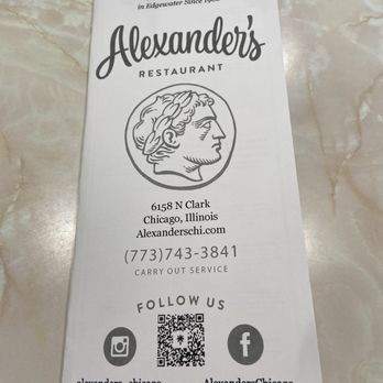 Alexander's Restaurant - Menu - A printed menu or flyer for Alexander's Restaurant in Chicago, Illinois, is shown on a marble table surface. It displays the restaurant's name, logo with a profile of a classical figure, address at 6158 N Clark, and contact number. The flyer includes social media icons for Instagram and Facebook, along with a QR code for additional information. The design emphasizes the restaurant's long-standing tradition since 1960 and offers carry-out service. - Diners Near Me - Chicago, Illinois