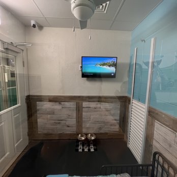 Pet Paradise Cedar Park - VIP Room w/ camera, guillotine door to patio, TV, and camera - Pet Boarding Near Me - Cedar Park, Texas Pet Paradise Cedar Park - VIP Room w/ camera, guillotine door to patio, TV, and camera - Pet Boarding Near Me - Cedar Park, Texas