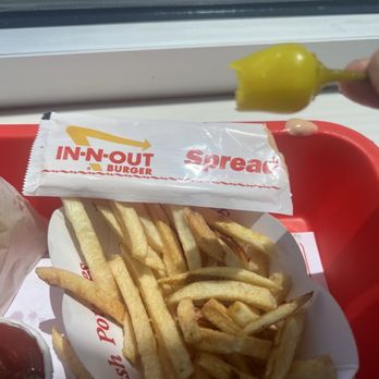 In-N-Out Burger - Fries and spread packet plus the bitten chili - Burgers Near Me - Hurst, Texas In-N-Out Burger - Fries and spread packet plus the bitten chili - Burgers Near Me - Hurst, Texas