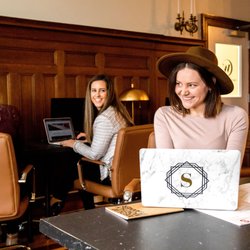The Worker's Club - The back room boasts original wood detail and high ceilings, and has 14 desks, each with a complimentary 25" monitor.