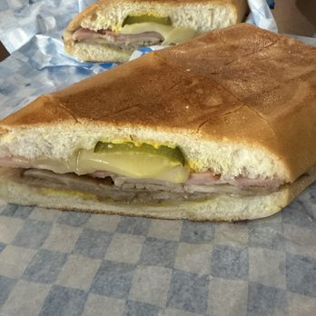 Sabroso Sandwich Shop - Cuban sandwich, regular size split in half. - Sandwiches Near Me - Daytona Beach, Florida