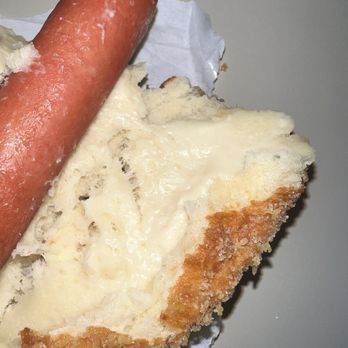T% Coffee + Tea - Davis  - Raw dough - A hot dog with a sausage on top of a slice of bread with melted cheese, placed on a paper wrapper. - Bubble Tea Near Me - Davis, California