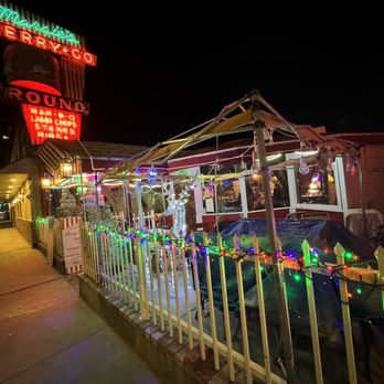 Merry Go Round - people sitting outside a restaurant at night - New American Near Me - Lone Pine, California Merry Go Round - people sitting outside a restaurant at night - New American Near Me - Lone Pine, California