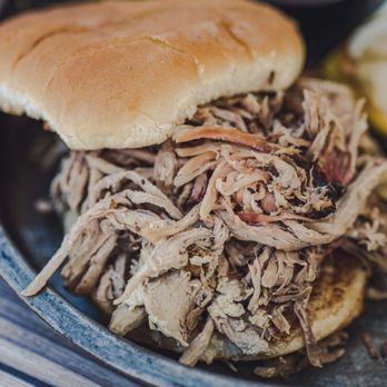 Smith and Betts Barbecue - a pulled pork sandwich on a plate - Barbeque Near Me - Gravette, Arkansas Smith and Betts Barbecue - a pulled pork sandwich on a plate - Barbeque Near Me - Gravette, Arkansas