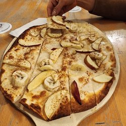 Spinnrädl - Sweet tarte flambée with apples, bananas, cinnamon, and sugar